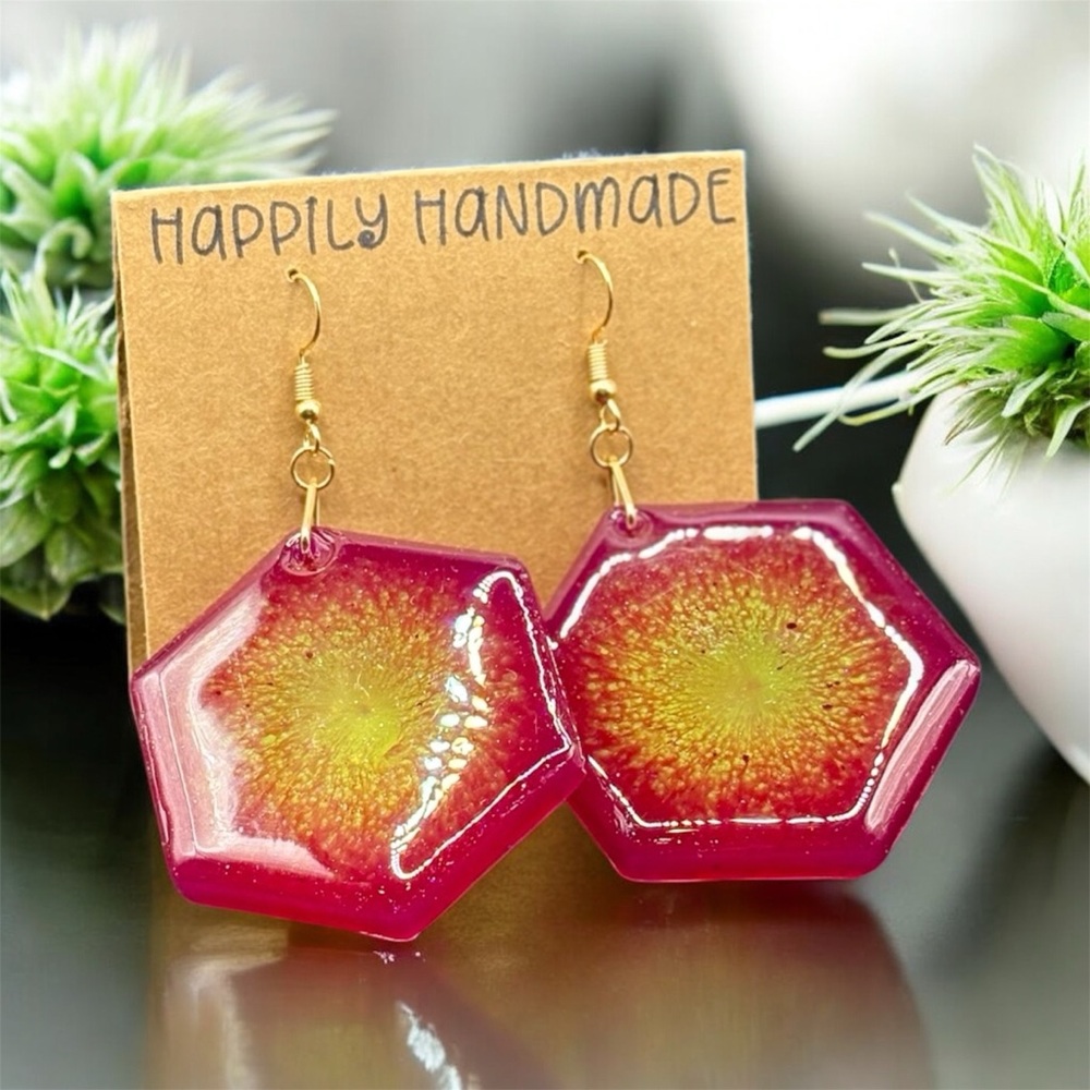 Handcrafted hexagon resin earrings in neon purple and neon yellow burst design